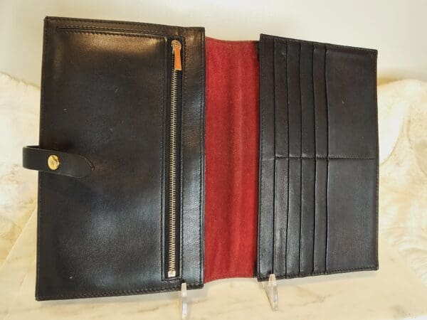 A black leather wallet opened to show the inside of it.