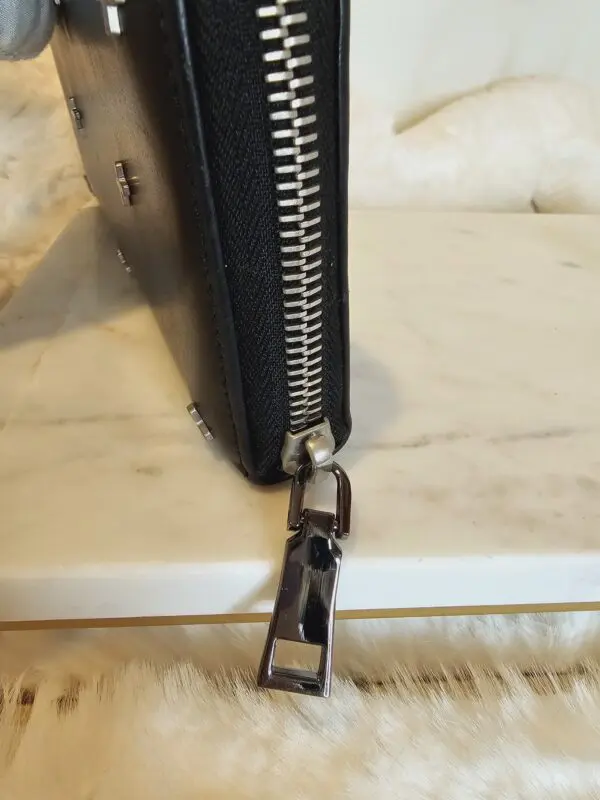 A close up of a wallet with a zipper