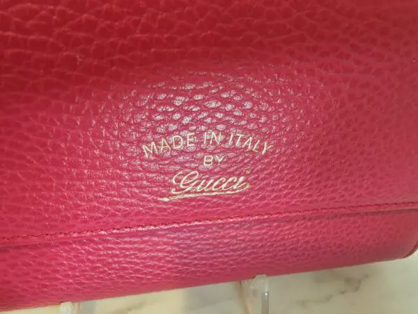 A close up of the inside of a gucci purse