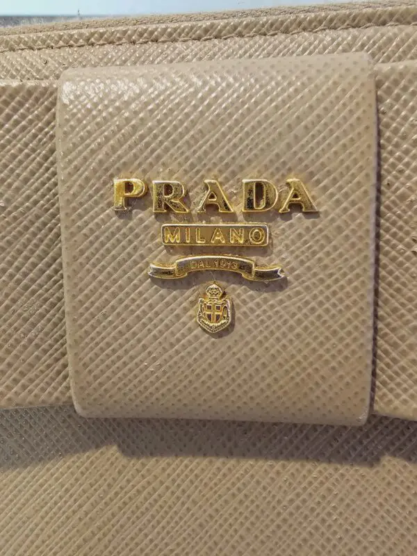 A close up of the prada logo on a purse