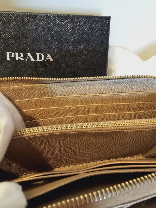 A close up of the inside of a prada wallet