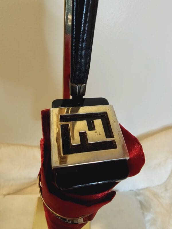 A close up of an fendi bag charm