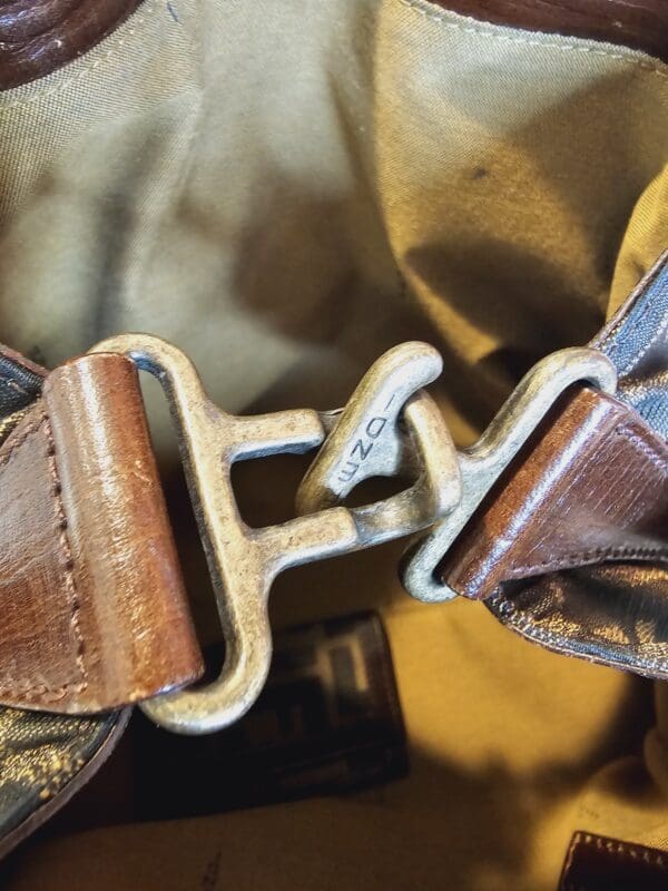 A close up of the buckle on a bag