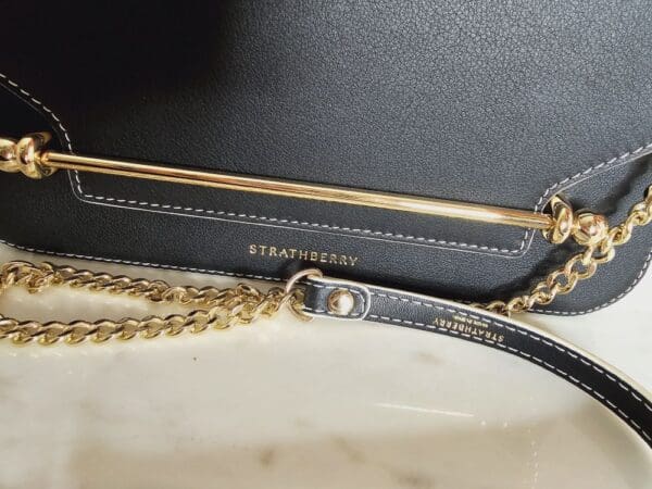 A close up of the strap on a purse