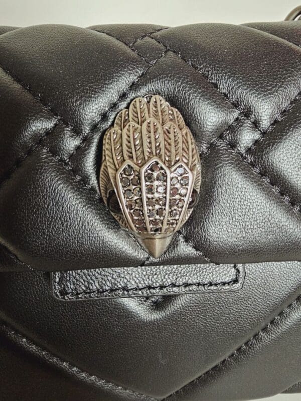 A close up of the leather material on a purse