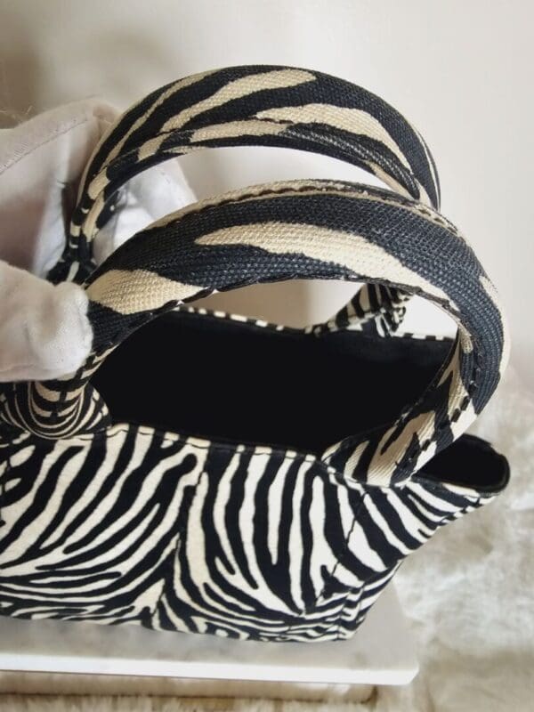 A close up of the inside of a zebra purse