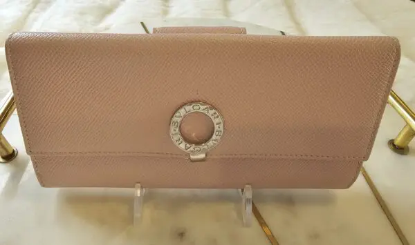 A close up of the front of a purse