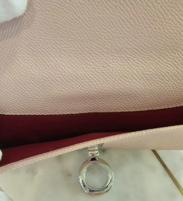 A close up of the ring on a purse