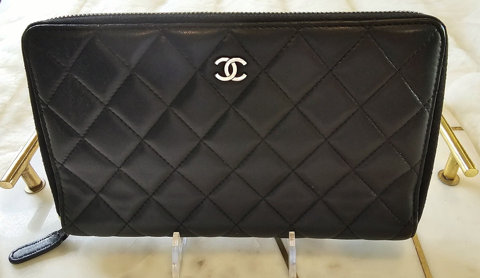 A black purse sitting on top of a table.