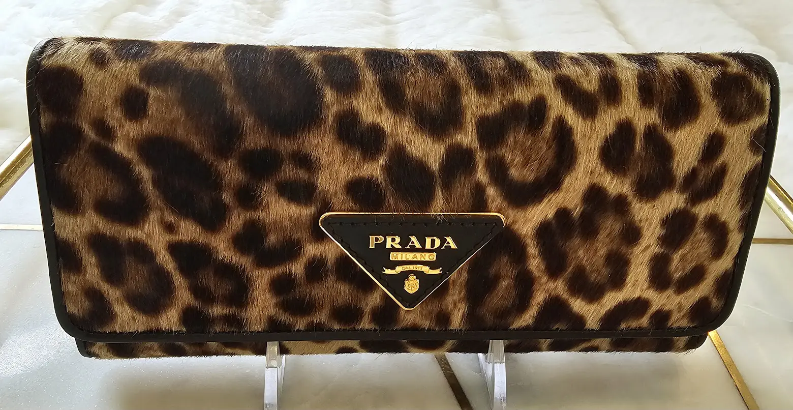 A close up of the prada logo on a purse