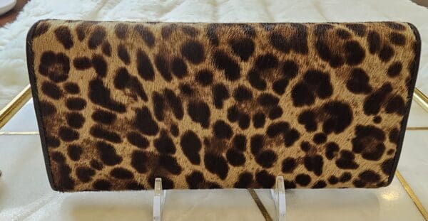 A leopard print table cloth on top of a white table.