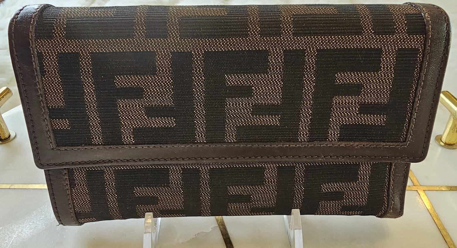 A close up of the fendi logo on a bag