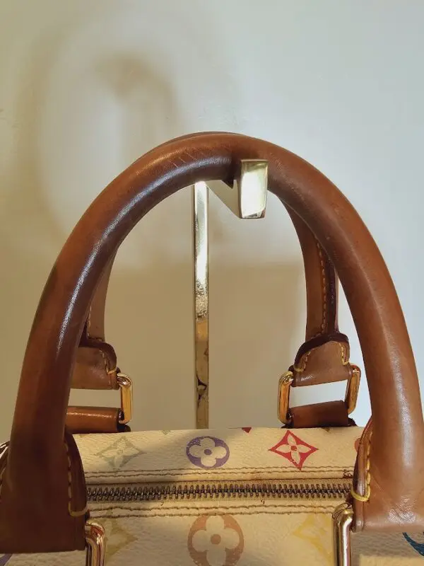 A brown bag with a handle on it