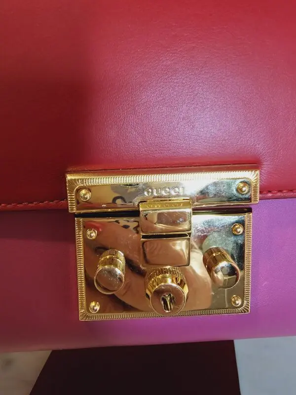 A close up of the lock on a purse