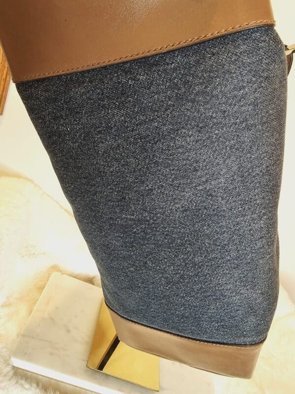 A close up of the leg of someone wearing a pair of jeans