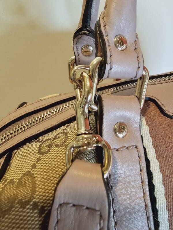 A close up of the strap on a purse