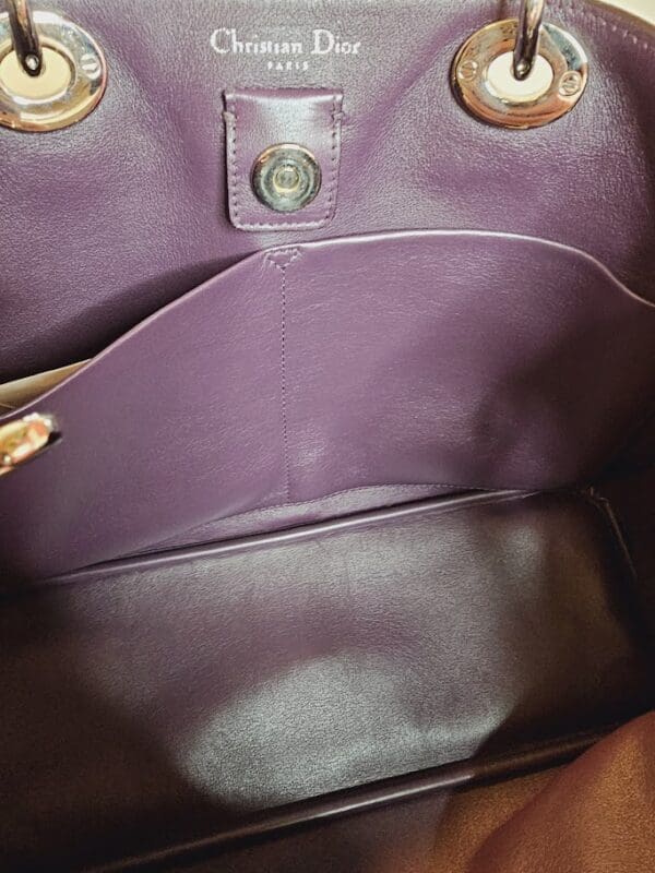 A close up of the inside of a purple purse