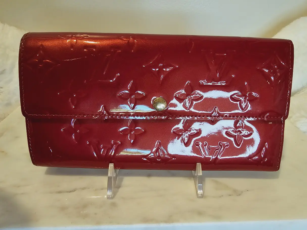 A red purse sitting on top of a counter.