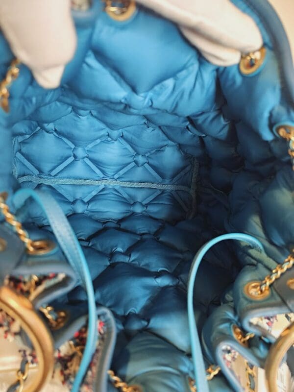 A close up of the inside of a blue purse