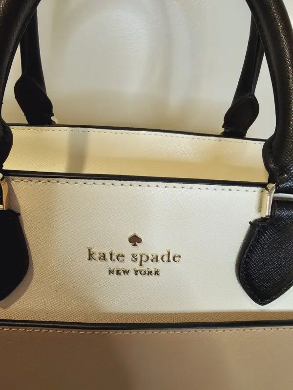 A close up of the inside of a kate spade bag