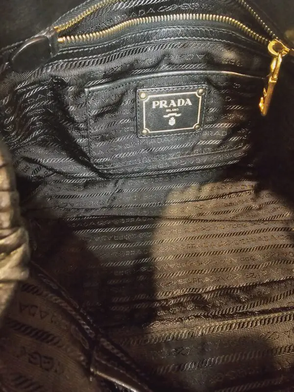 A close up of the inside of a prada bag