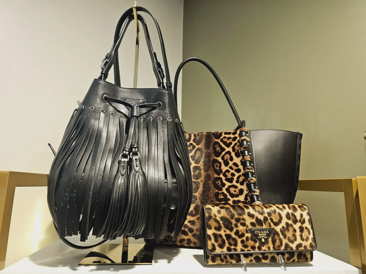 A group of bags and purses sitting on top of a table.